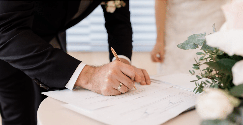 FC - couple signing official marriage