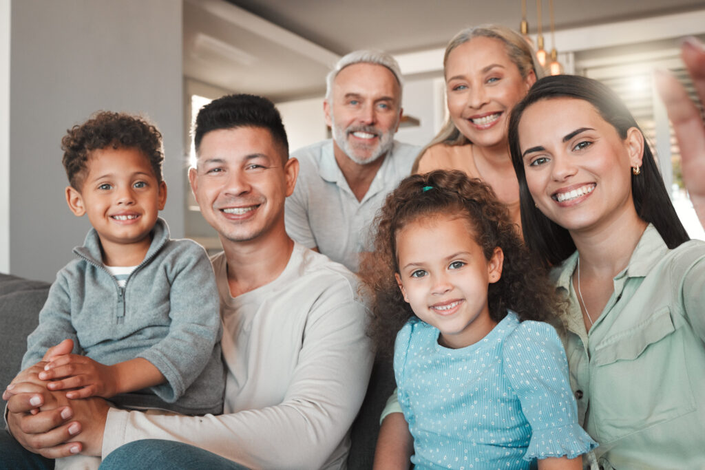A picture perfect family. Shot of a family taking a selfie together at home