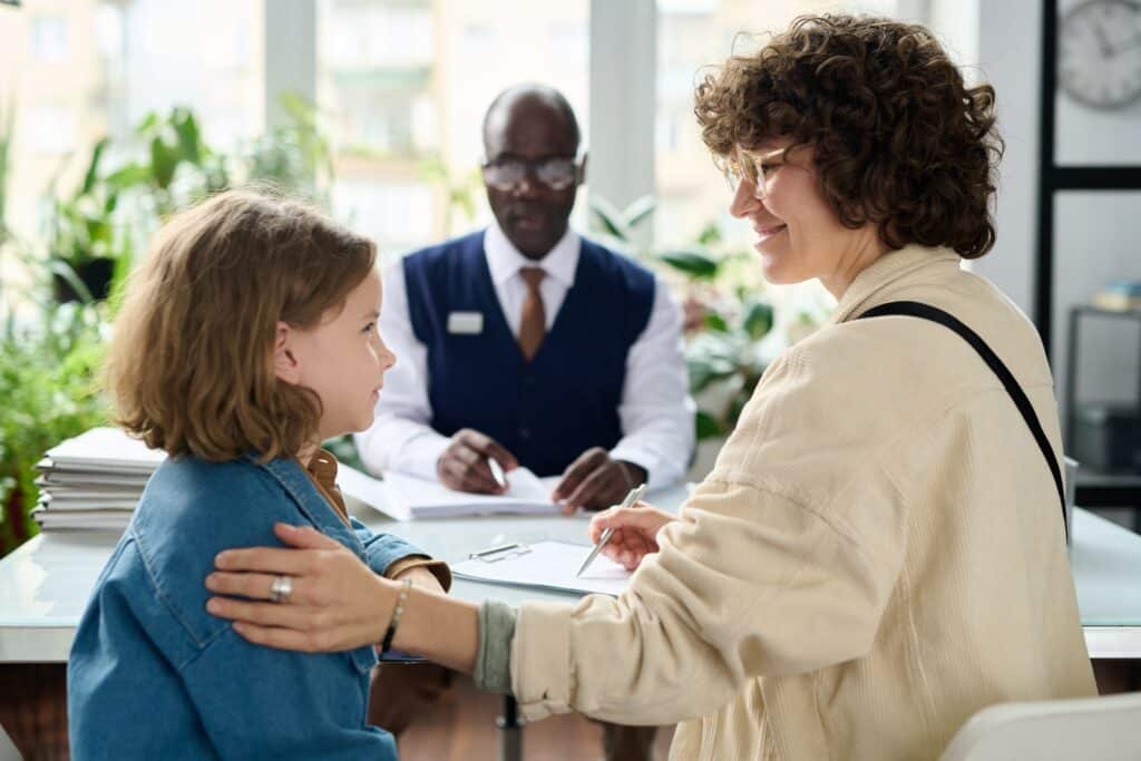 Young mother and child smiling in social workers office, sexual assault allegations, such accusations, certain circumstances,legal support