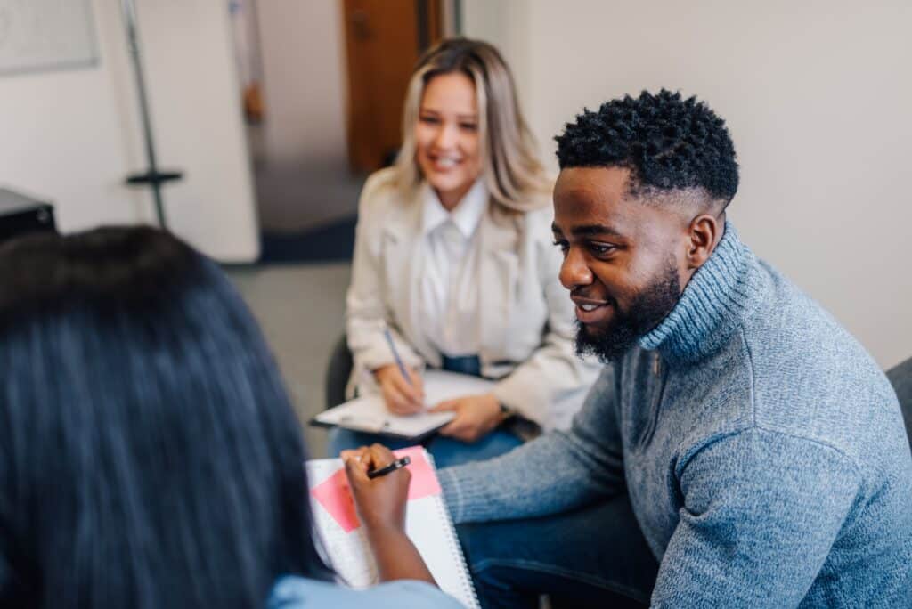 De facto couple meeting with a professional to discuss relationship registration and legal options