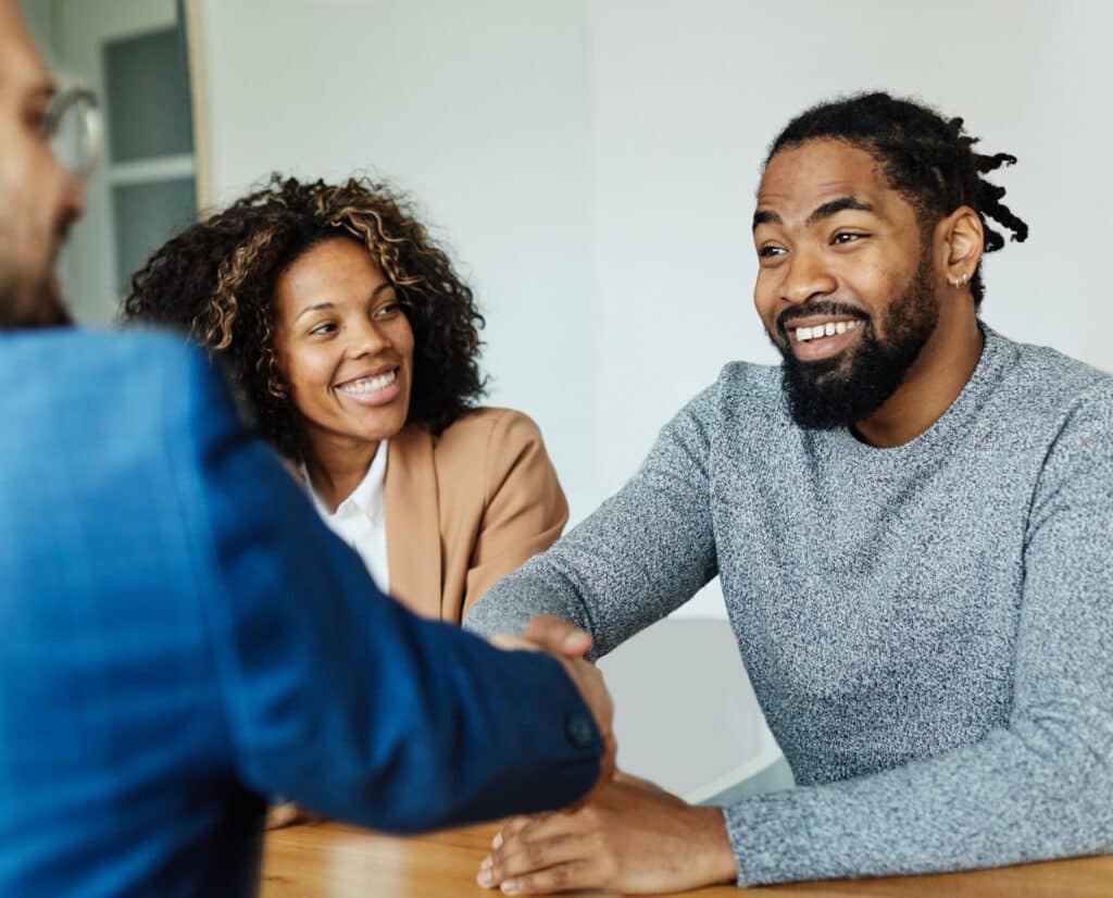 Couple meeting with a legal adviser to discuss registering a de facto relationship in Queensland